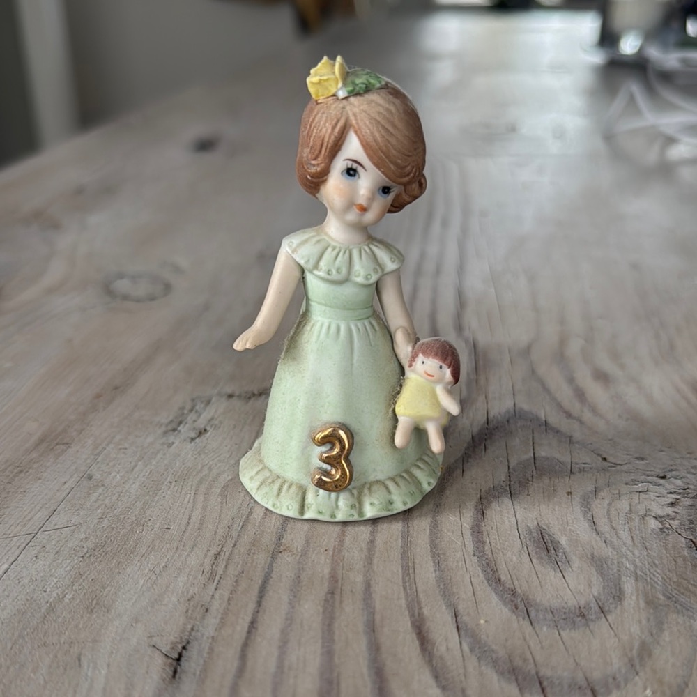 “growing up” collectible, age 3Vintage Porcelain Girl Figurine with Doll